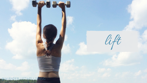 woman lifting weights overhead